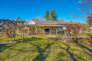 an image of a house with a yard at Hocking Hills Hideaway with Hot Tub and Fire Pit! in Logan