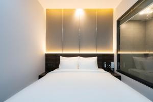 Postel nebo postele na pokoji v ubytování CÁT ANH HOTEL