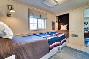 A bed or beds in a room at Chic Harrison Home with Lake Views!