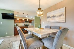 a kitchen and dining room with a table and chairs at Family-Friendly Peoria Retreat with Private Pool! in Peoria