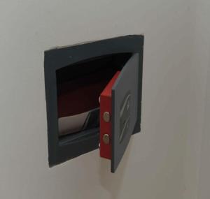 a small black and red box on a white background at Casa vacanze Ecce Homo in Ragusa