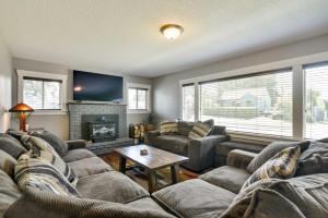 a living room with couches and a fireplace at Charming Portland Home, Walk to Light Rail! in Milwaukie
