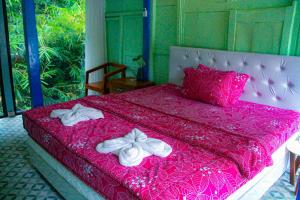 Villa Kamar Tamu Selomartani 2客房内的一张或多张床位