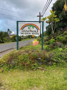 a sign on the side of a road at Hana Maui Vacation Rentals "HOME" Hana Hale in Hana