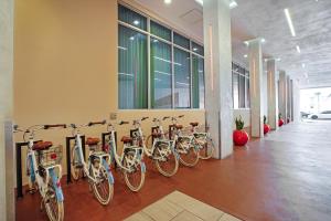 a row of bikes lined up against a wall in a building at CH Luxury Condos & Studios On The Beach in Hollywood