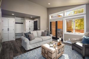 a living room with a couch and a table at 128 McCloud - Luxury Couples Retreat in Incline Village