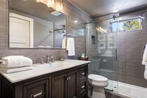 a bathroom with a toilet and a sink and a shower at 128 McCloud - Luxury Couples Retreat in Incline Village +15 photos