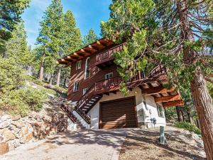 a home in the woods with a garage at Fantastic Lakeview house with large decks! in Incline Village