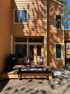a wooden table in front of a house at 147 McCloud - The Perfect McCloud Getaway in Incline Village