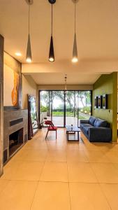 a living room with a couch and a fireplace at Casa 1800 Cerro Verde in Cerro Verde