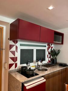 Una cocina o zona de cocina en Flat Ipanema com Garagem