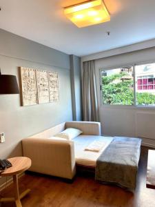Cama o camas de una habitación en Flat Ipanema com Garagem