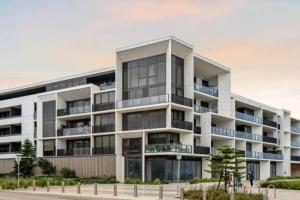 an apartment building with a lot of windows at 309 Waterfront in Werribee South