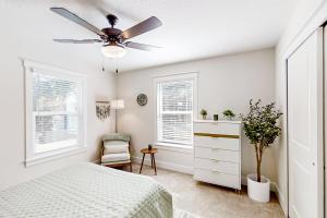 a bedroom with a bed and a ceiling fan at Liberty Manor in Jacksonville