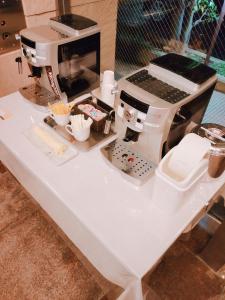 a white table with a sewing machine on it at Inuyama City Hotel in Inuyama