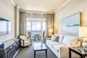 a living room with a couch and a table at Marco Beach Ocean Resort 1202 in Marco Island