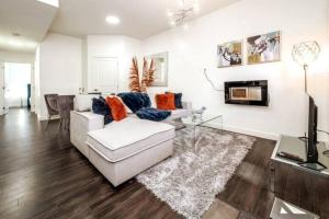 a living room with a couch and a fireplace at Chic Suite - Long Stays - King Bed - Fireplace & WiFi in Edmonton