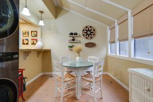 a dining room with a table and chairs at Deluxe Townhome with Deck, 2 Mi to Downtown Modesto! in Modesto