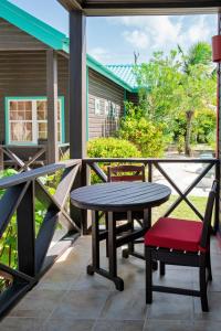 a patio with a table and a bench and a table and chairs at X'tan Ha- The Waterfront in San Pedro