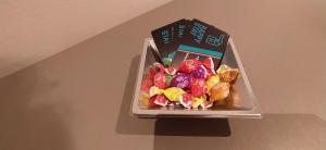 a plastic container filled with candy on a table at Hostal Happystay in Valencia