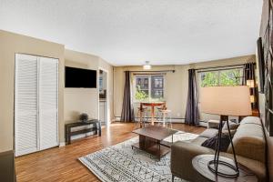 a living room with a couch and a table at Central Respite in Seattle