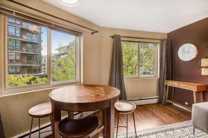 a living room with a table and chairs and a window at Central Respite in Seattle