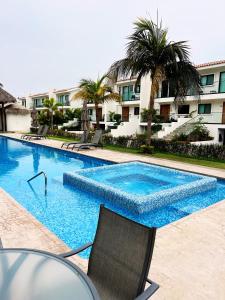 Swimming pool sa o malapit sa Espectacular Departamento en Club de Golf El Tigre