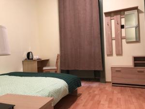 Postel nebo postele na pokoji v ubytování Kecskeméti Rooms