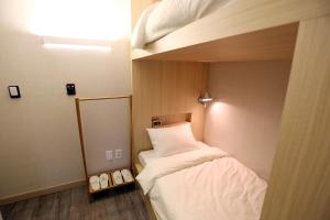 Katil atau katil-katil dalam bilik di Hotel 8 Hours