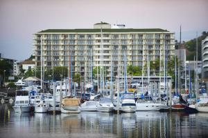 a group of boats docked in front of a large building at Aligned Corporate Residences Townsville in Townsville