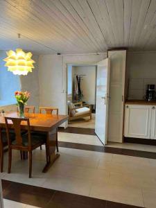 a kitchen and dining room with a table and chairs at Independent apartment in Borås in Borås