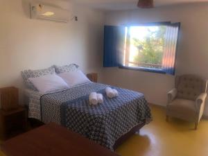 Postel nebo postele na pokoji v ubytování Ao som do mar Bahia