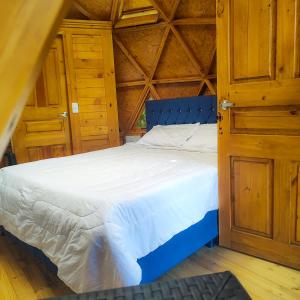 Säng eller sängar i ett rum på Hotel torogua