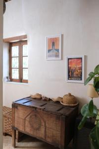 a room with a wooden table in the corner of a room at Dar Rafti in Fez