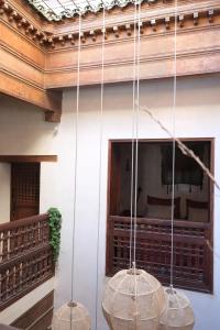 three baskets hanging from a ceiling in a room at Dar Rafti in Fez