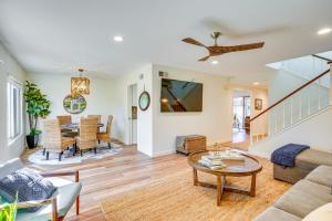 a living room with a couch and a table at 1 Mi to State Beach! Dog-Friendly Dana Point Condo in Dana Point