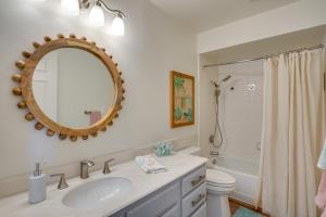 a bathroom with a sink and a toilet and a mirror at 1 Mi to State Beach! Dog-Friendly Dana Point Condo in Dana Point +23 photos