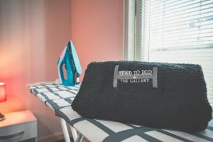 a black blanket sitting on top of a table at Dockside Penthouse Albert in Liverpool