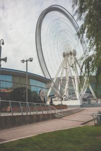 a large roller coaster in front of a building at Dockside Penthouse Albert in Liverpool