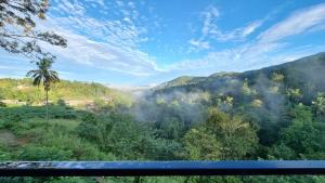 a view of the mountains from a train window at The Ridge House in Kandy