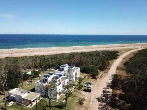 an aerial view of a building on the beach at Arenas Garzón in José Ignacio