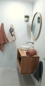 a bathroom with a sink and a mirror at Spacious Unit in Convenient Location in Yarrawonga