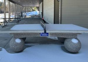 a concrete bench with snow on top of it at Casa Azul in Bracebridge