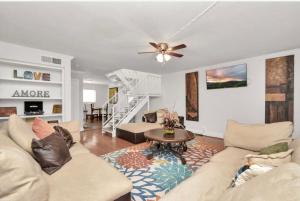 a living room with a couch and a table at Peaceful Queen Master Suite in Houston