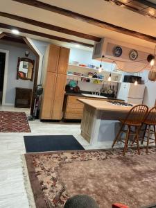 a kitchen with a table and chairs in a room at The Apartment at Sky Hollow in Rochester