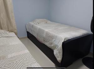 Un ou plusieurs lits dans un hébergement de l'établissement Apto 3 habit +2TV-Wifi, Netflix-Parqueadero gratis