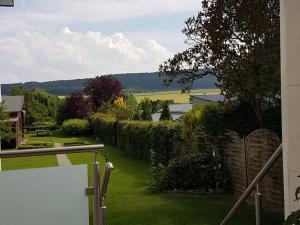 a view of a garden from the balcony of a house at Apartment in Bissendorf near Osnabrück in Bissendorf