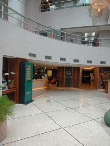 a view of a large building with a lobby at Studio Living Quality Jardins in Sao Paulo
