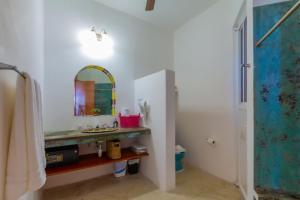 a bathroom with a sink and a mirror at Casa Cielo 2 Bedroom Oceanfront Villa in Isla Mujeres +48 photos