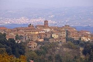 a town on top of a hill with buildings at Villa Della Certosa in Gambassi Terme +22 photos